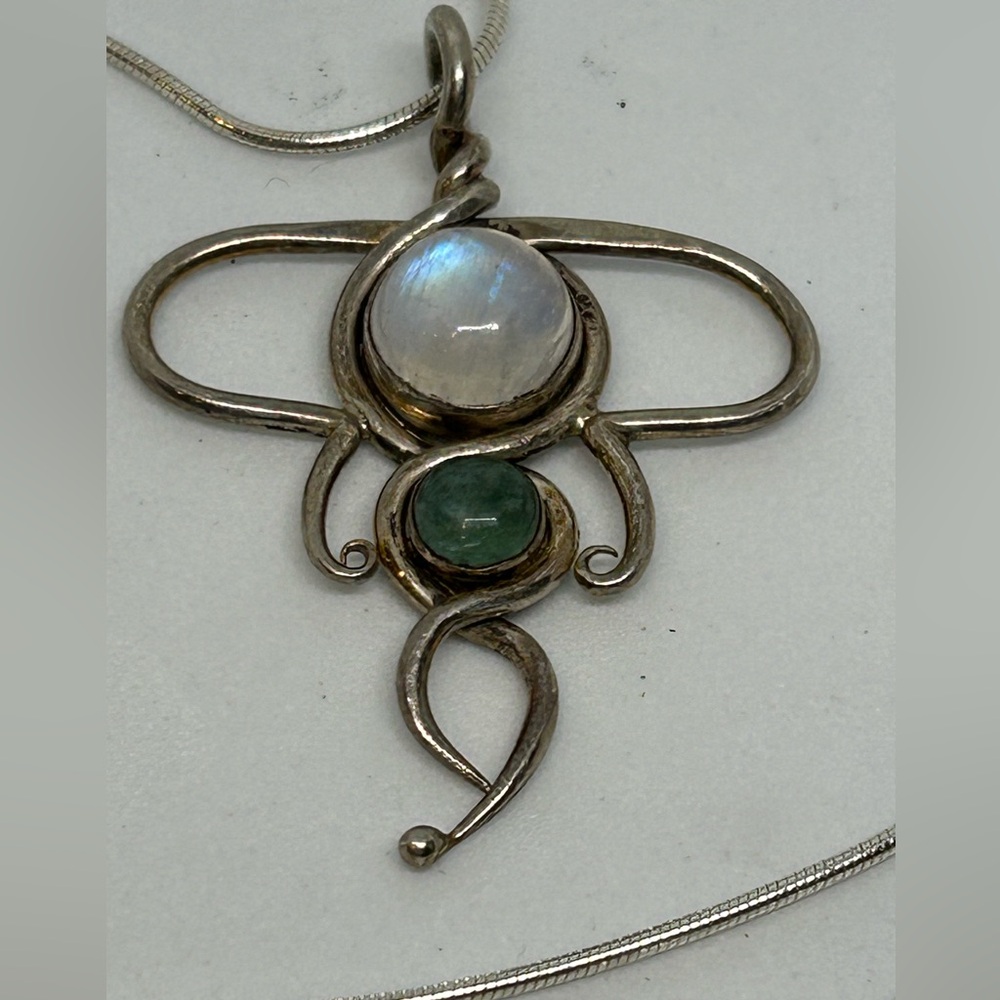Silver tone moonstone and green stone artisan pendant and chain marked Italy.